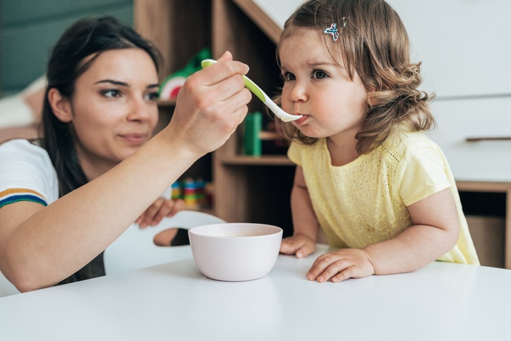 Happy child during home health feeding therapy session in Houston, TX